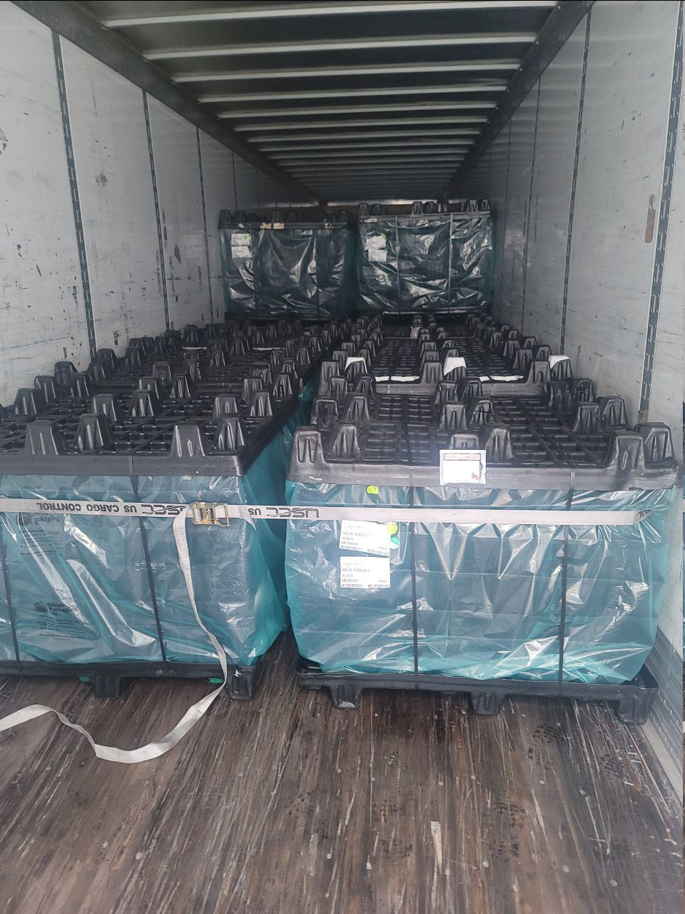 Palletized cold chain freight secured inside a refrigerated reefer trailer for food-safe service