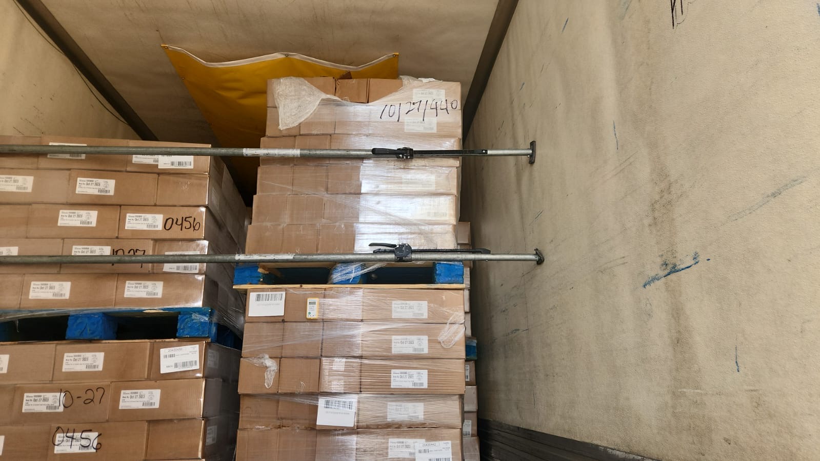 Palletized freight staged inside a warehouse ready for outbound logistics handoff